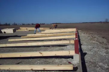pole barn post brackets frame on ground